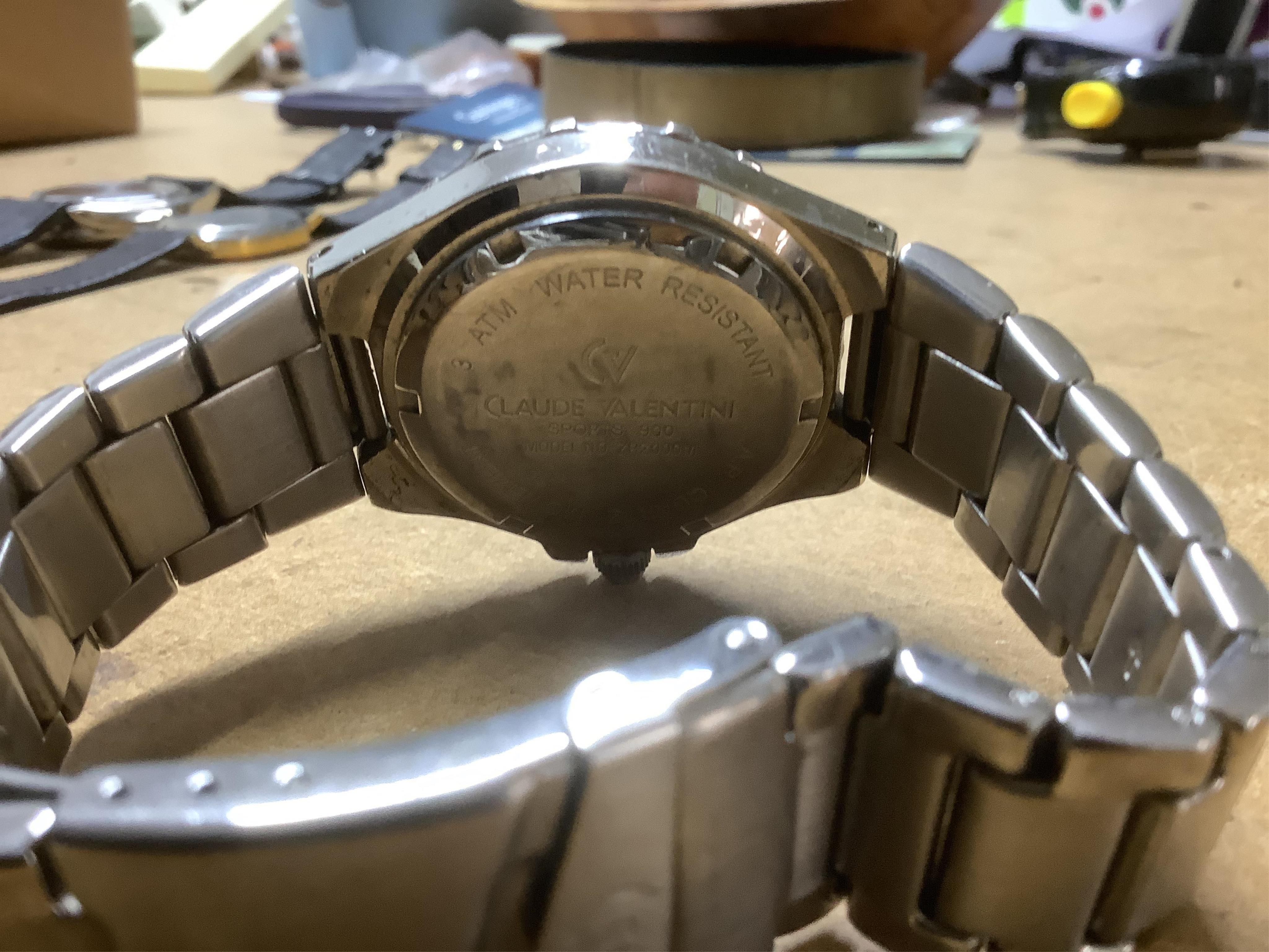 A group of assorted mainly costume and other jewellery including a silver bracelet hung with assorted coins and a Victorian enamelled mourning brooch, together with wrist watches, white metal box etc. Condition - poor to